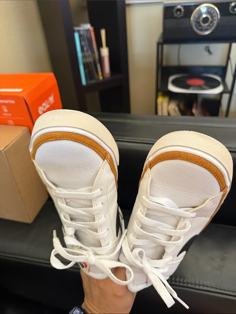 Nike White Low-Top Sneakers with Black Swoosh and Brown Trim